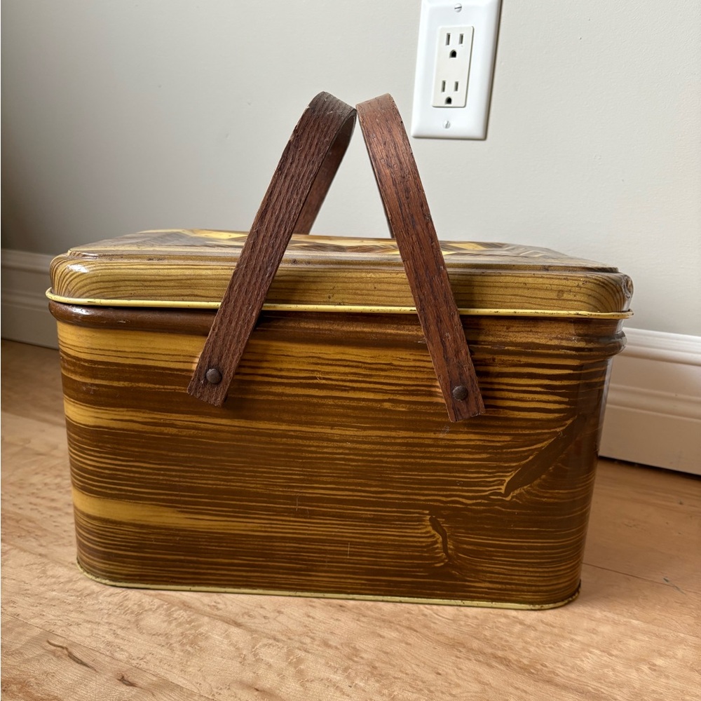 vintage metal picnic basket with a faux wood grain design